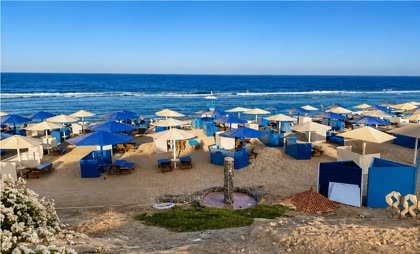 Parasols, loungers and windbreaks along the beach at Akassia Swiss Resort
